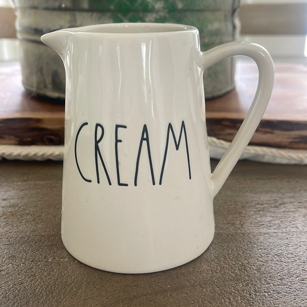 Rae Dunn “Cream” pitcher. Small chip on the bottom lip. See photo.